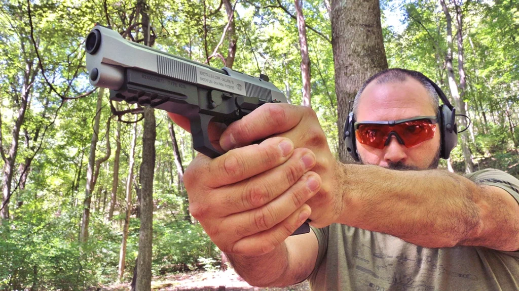 The author shooting the Beretta 92 XI SAO.