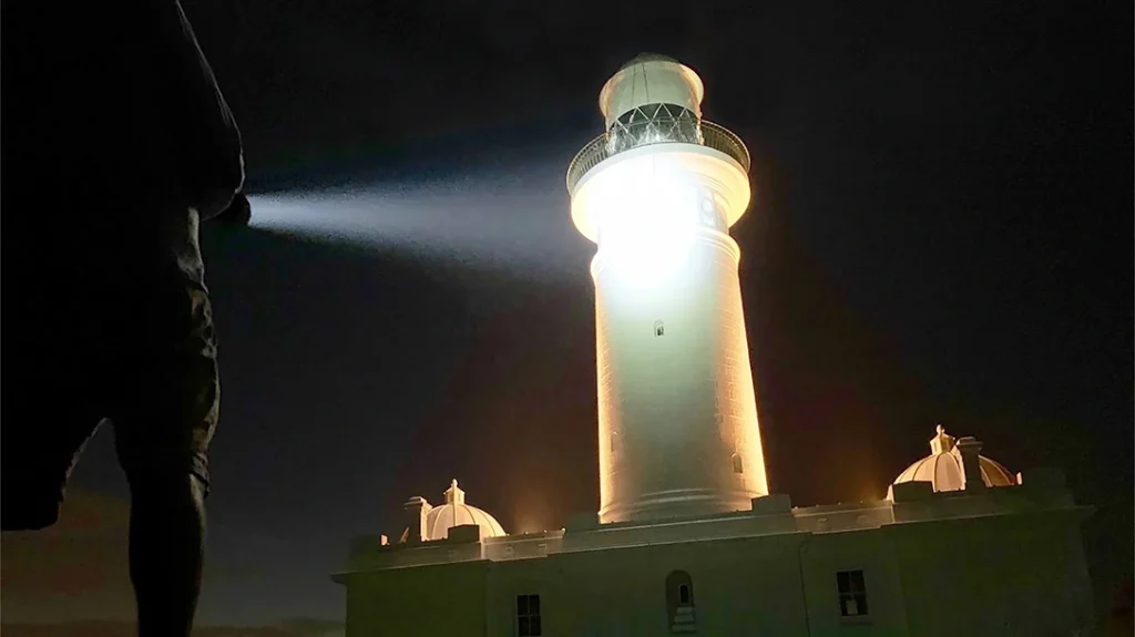 The Ledlenser X21R flashlight lighting up a lighthouse.