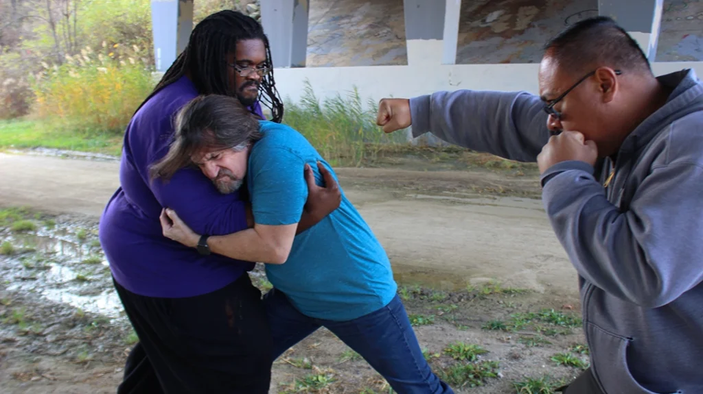 Don locks horns with the largest of the group, leaving him defenseless against the other attacker.