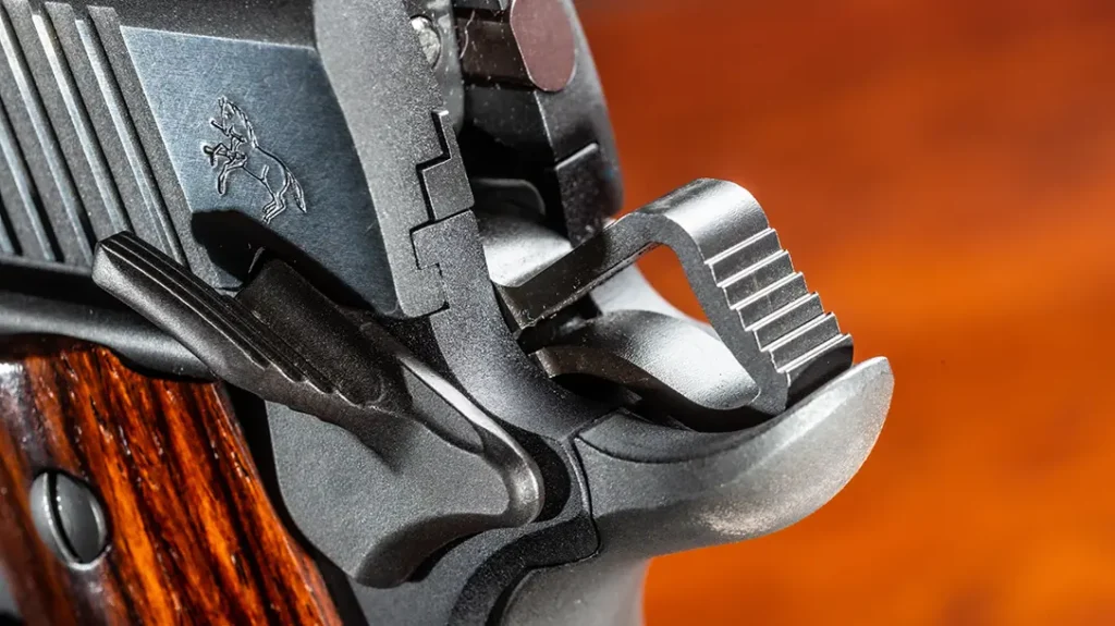 The author had to polish the rear of the sear where it engages the thumb safety with emery paper taped to a piece of glass.