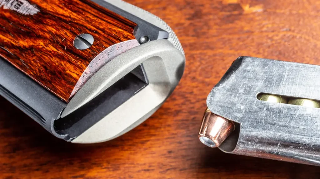 The author replaced the mainspring housing in his Colt Gunsite Lightweight Commander with a one-piece Smith & Alexander aluminum mag guide (GMAS).