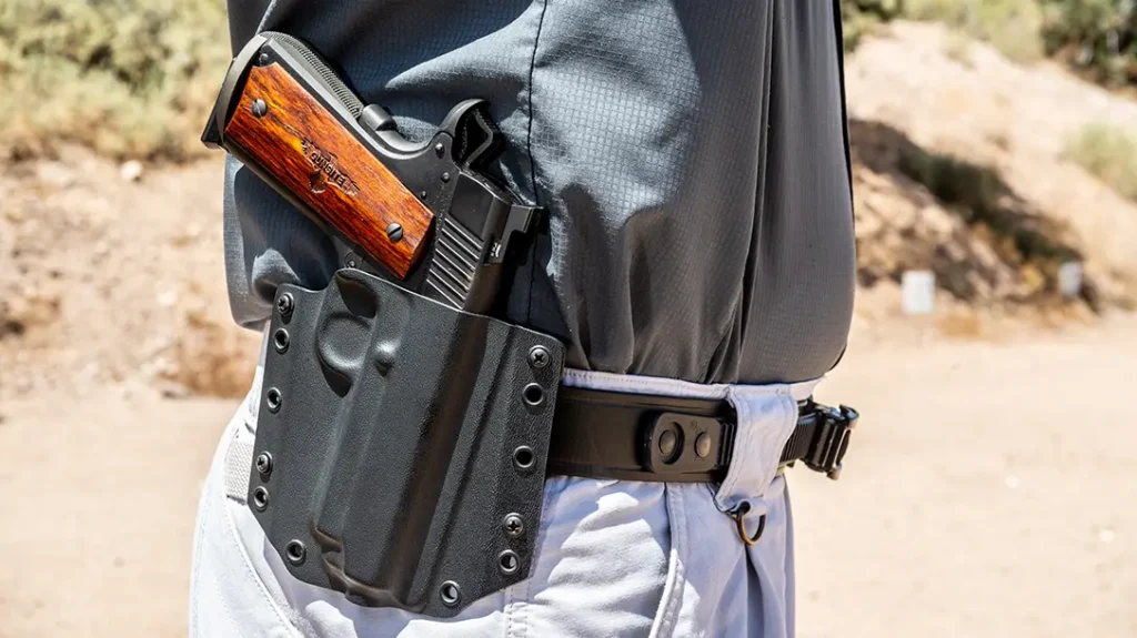 While training, the author split holster duties between the nostalgic Davis rig and a Bravo Concealment Kydex holster.