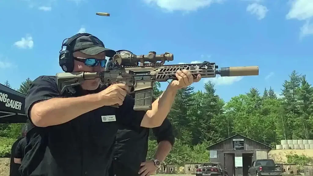 Reach out for a comfortable grip on the forend when learning how to hold a rifle. 