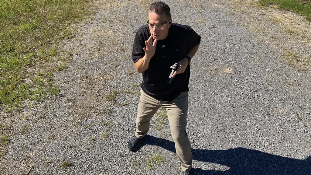 The combat fighting stance demands that your feet be spread wide apart, like the base of a pyramid.