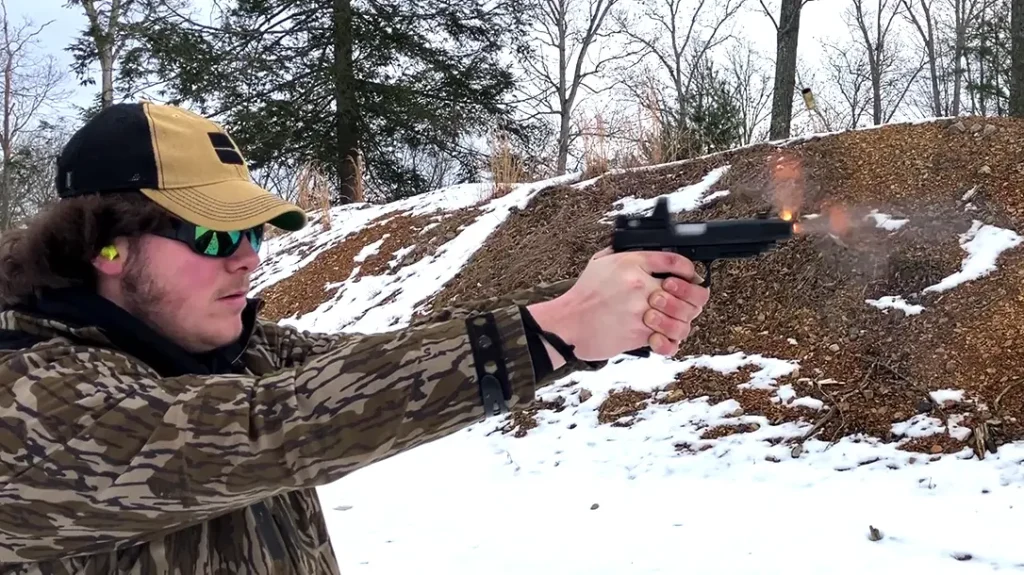 Upward thrust of muzzle gasses from the Comp barrel.