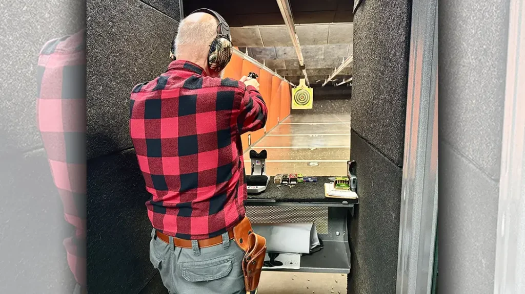 The author shooting the Henry Golden Boy revolver.