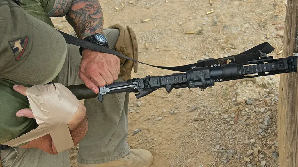 Now, pick up your rifle and ram it forward into the vehicle’s tire, with your body against the stock.