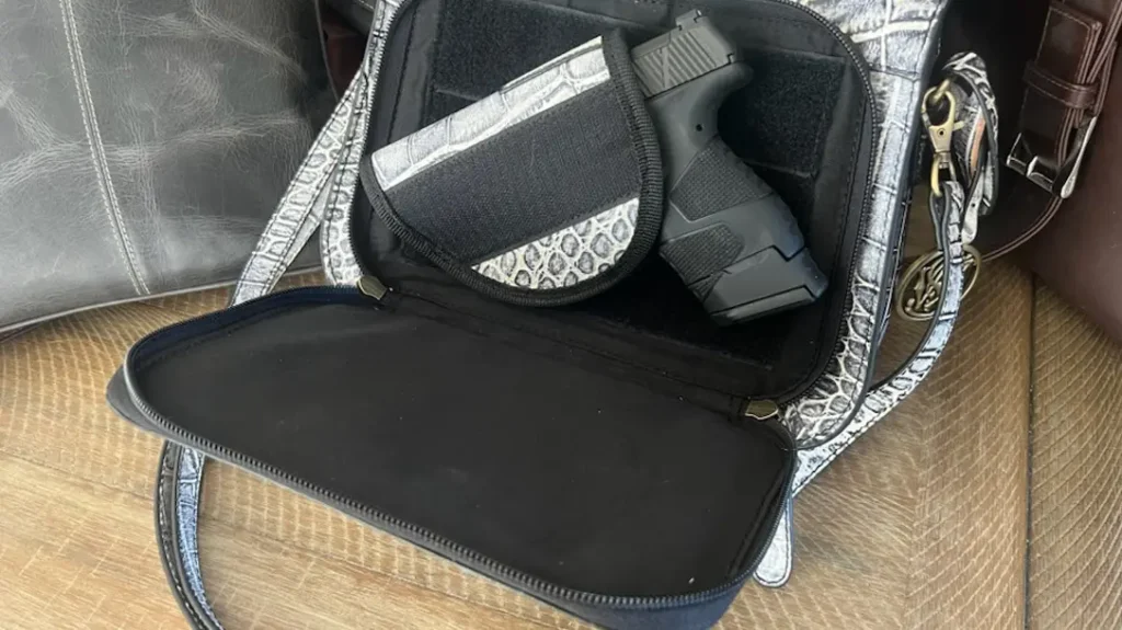 This compartment should include a strong velcro/holster combination that keeps the gun from shifting and maintains good retention.
