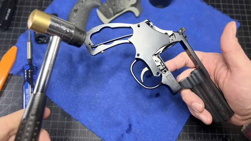 Smith & Wesson Revolver Maintenance: Never pry the plate off—doing so could warp it and mar it internally. A few taps should make it pop loose. Be patient—keep tapping.