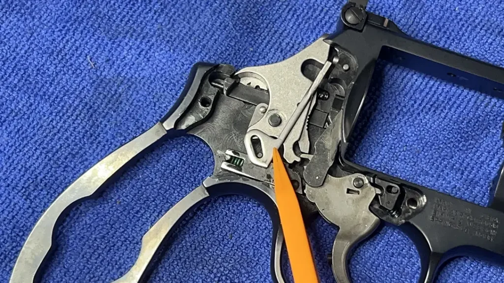 Smith & Wesson Revolver Maintenance: Lift out the hammer block safety.