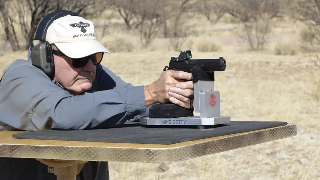 With his target set out at 25 yards, the author fired 5-round groups from a seated rest using my DOA Tactical portable shooting bench.
