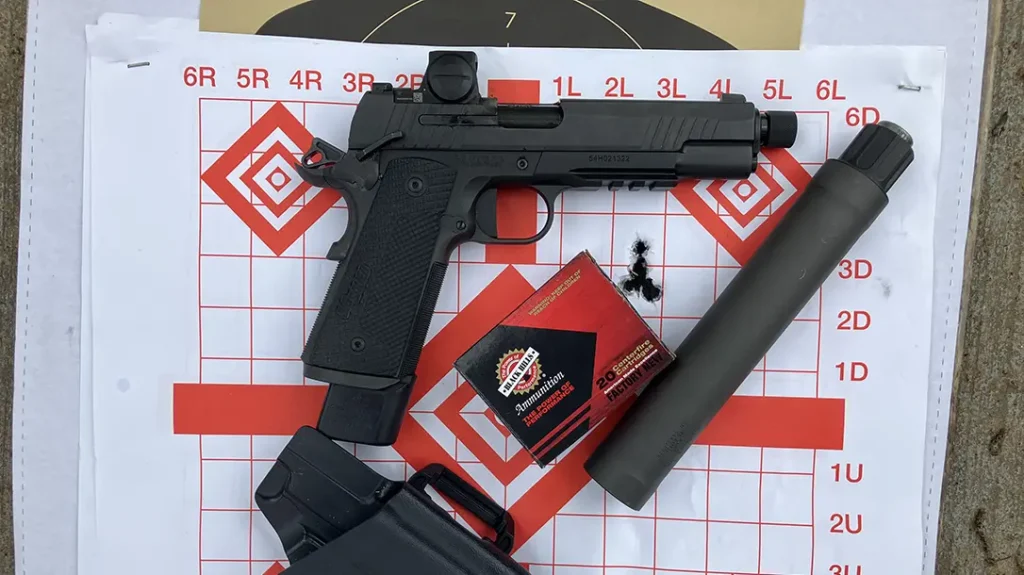 Shooting the SIG 1911 from sandbags regularly produced singular jagged hole five-round groups at 12 yards.