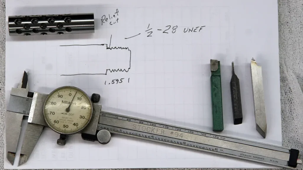 Sketching out a blueprint before turning down the barrel. 