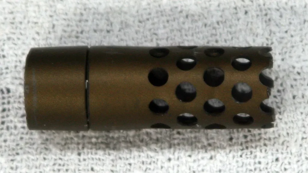 A common muzzle brake before attaching to a rifle. 