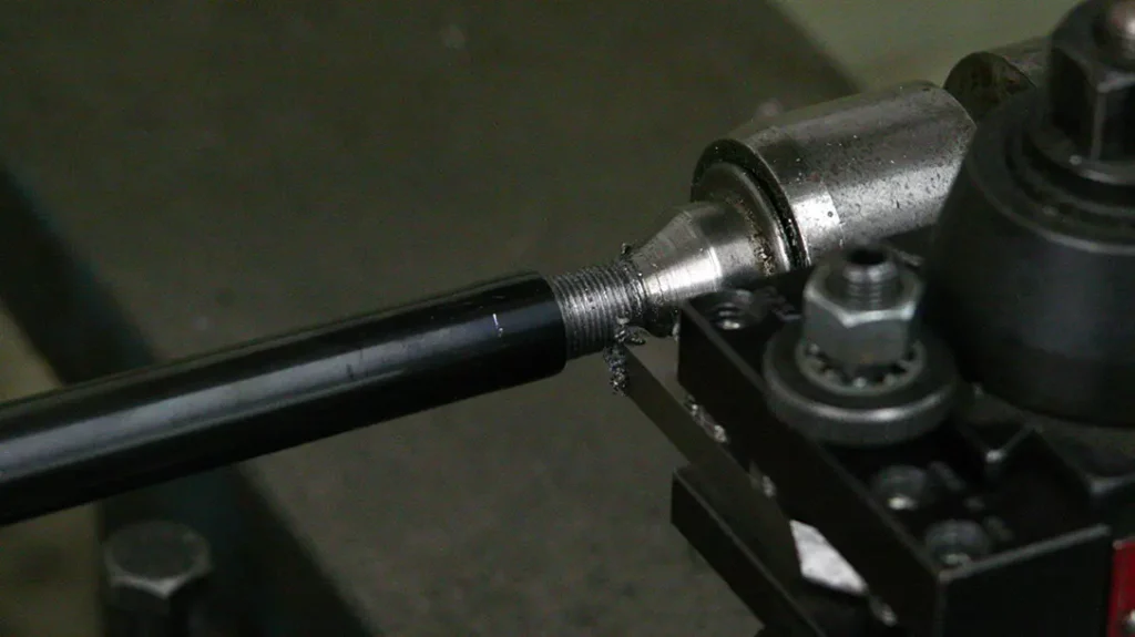 Turning down a barrel to add a muzzle brake. 