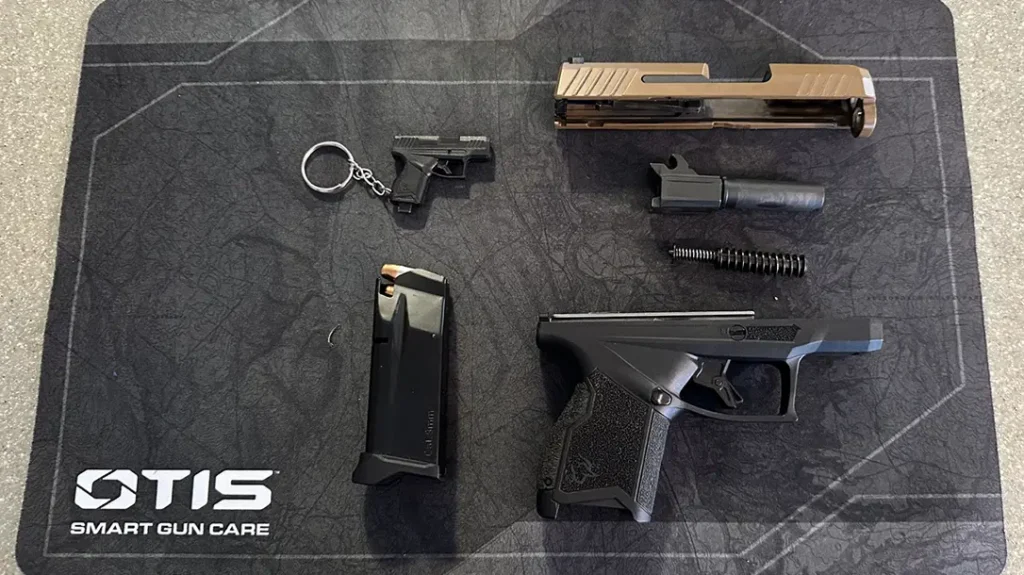 Before the author knew it, the frame, slide, recoil spring, and barrel were lined up on the mat, ready for cleaning. The process of field stripping her handgun was complete.