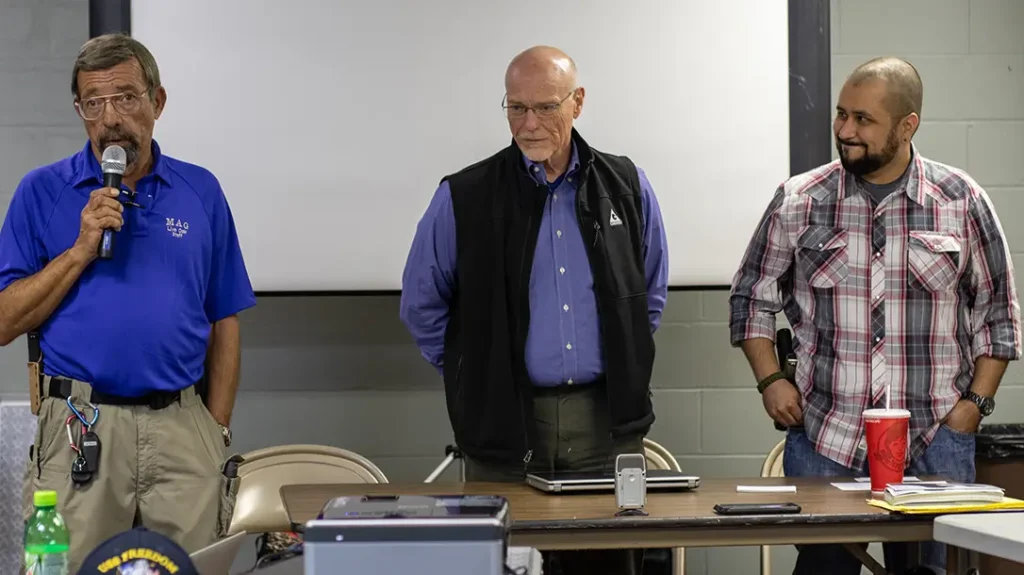 Ayoob (left) introduces attorney Don West (center) and George Zimmerman, whose statements to police convinced them not to arrest him after the shooting of Trayvon Martin in 2012.