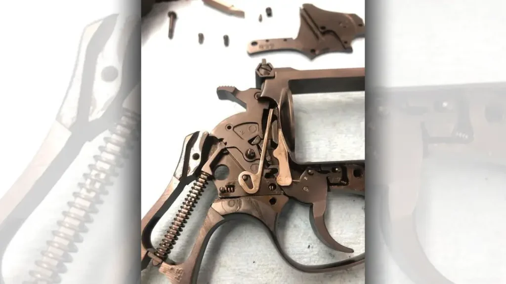 With the sideplate removed, the only significant difference is that the Rossi RM64 uses a coil mainspring instead of the flat leaf mainspring S&W uses.