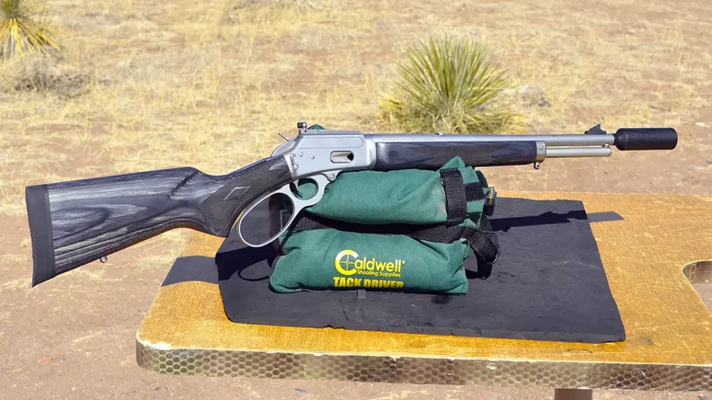 Banish 9K attached to lever-action rifle.