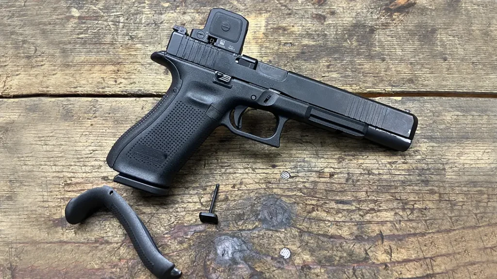 GLOCK G17L Gen5 MOS with Trijicon RCR red dot optic mounted via MOS adapter plate. The medium beavertail backstrap has also been added.