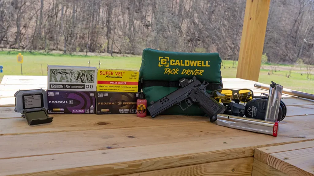 The author’s friend Maggie shooting the Military Armament Corporation MAC 9 DS-D Comp.