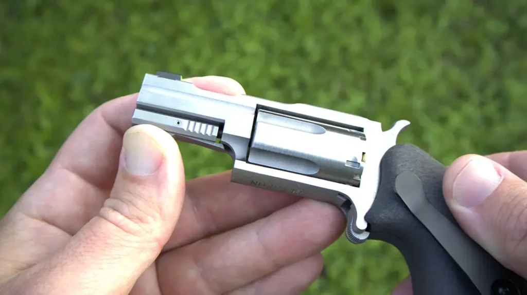 The cylinder must be removed for loading, and the cylinder pin can be used to punch out empty shells.