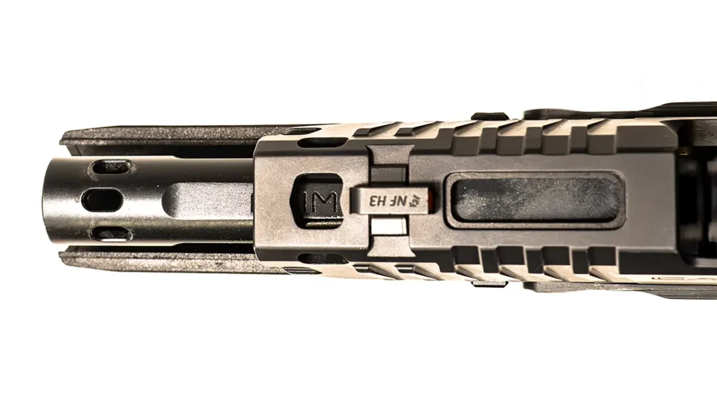 The enhanced compensated barrel and slide features an integrated expansion chamber.