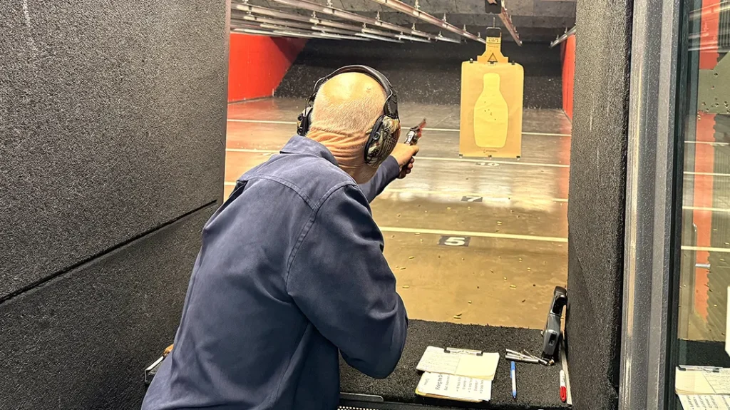 Author shooting support-hand only at 5 yards during the practical shooting exercise.
