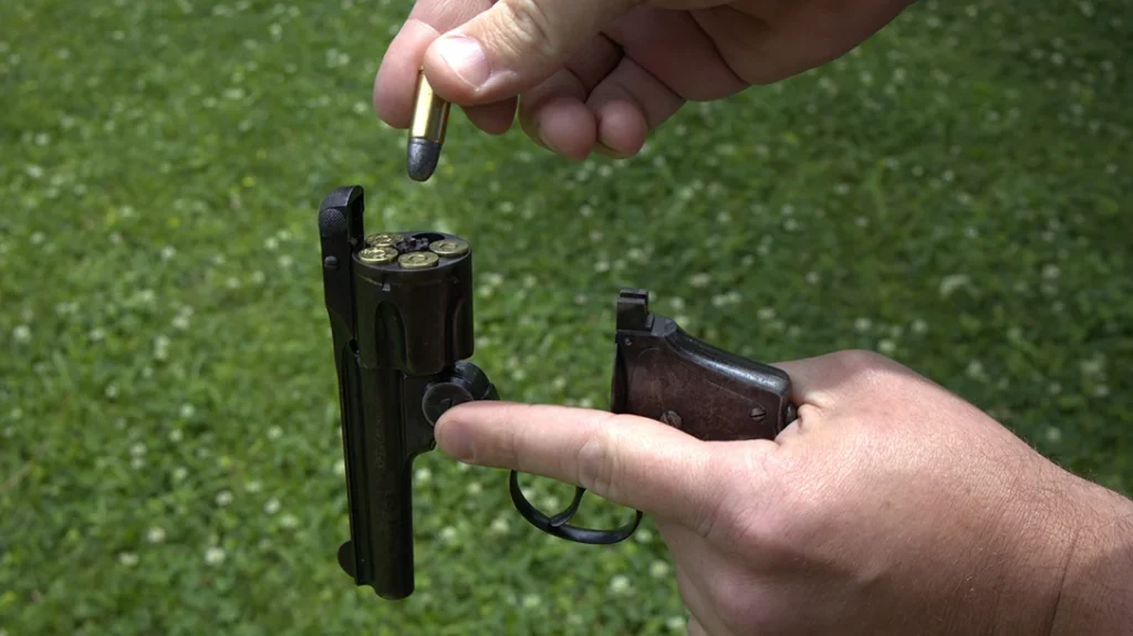 Loading the Lemon Squeezer is simple. Draw the cylinder latch upward with your off-hand fingers and tip the barrel forward.