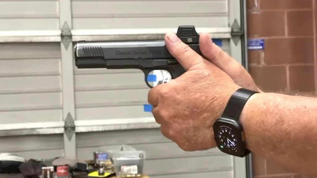 Using the “thumbs up” grip keeps your thumb on the safety.