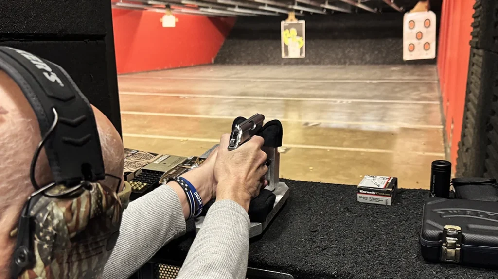 The author testing the Walther PPK/s SD from the bench for accuracy.