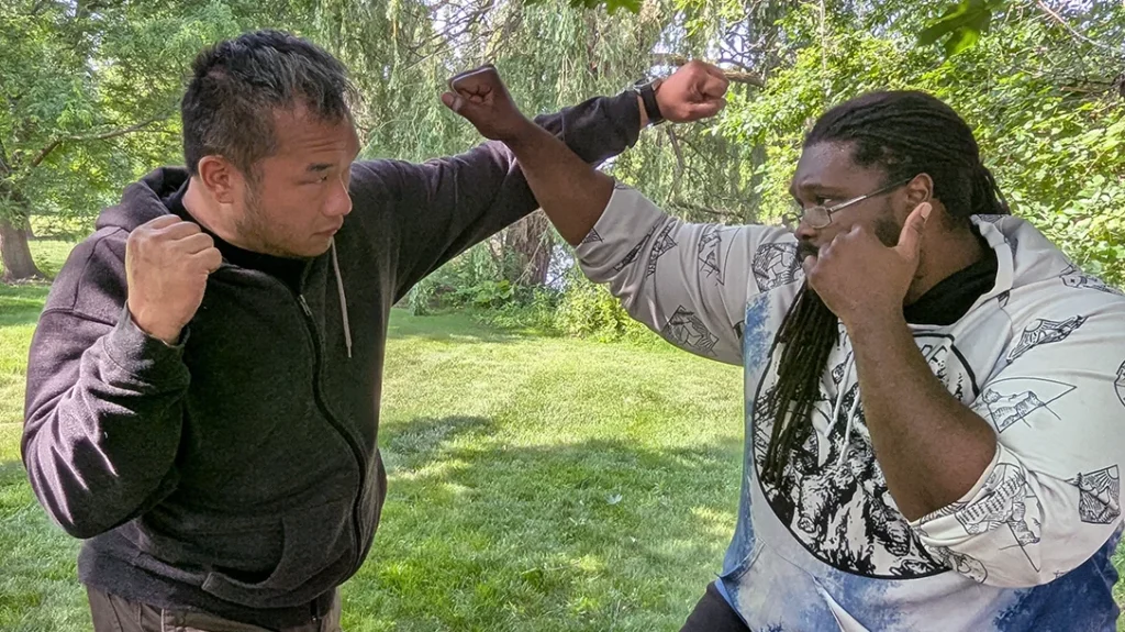 Kysean uses an Outside Middle Block to defend against a looping overhand from Sam. Opening up Sam’s centerline for a counter strike.