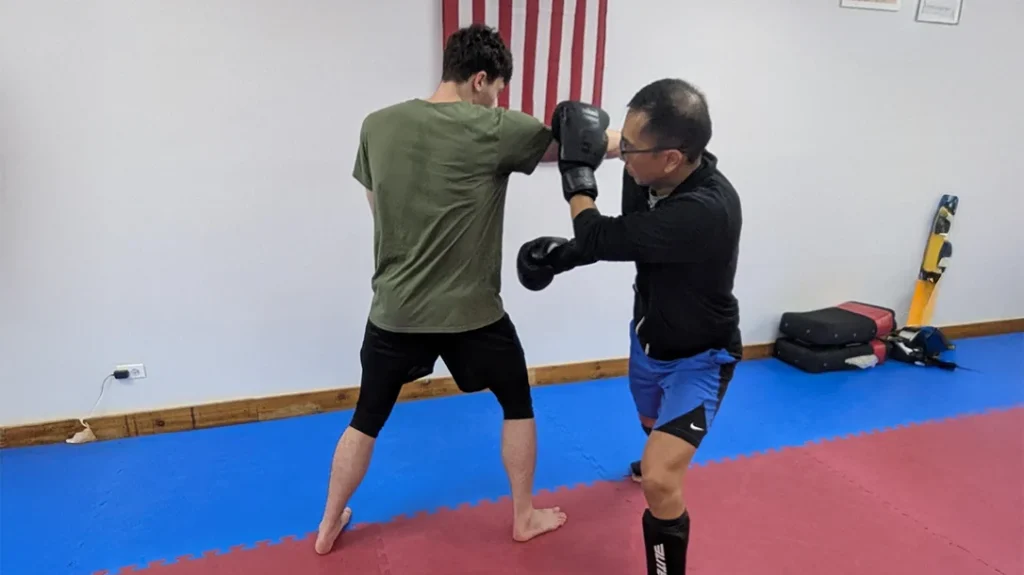 Ben counters with a right punch (Angle 2) against Adam. Adam Steps outside of Ben’s punch with an ANGLE 2 V-STEP.