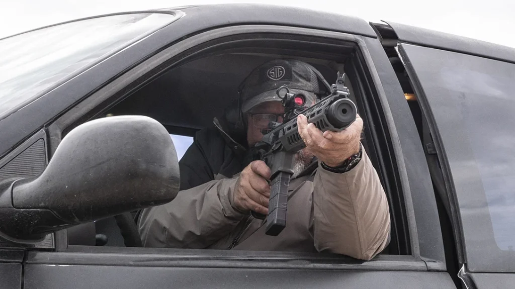 If you are going to carry a truck gun, practice accessing it and fighting from inside and outside your truck.
